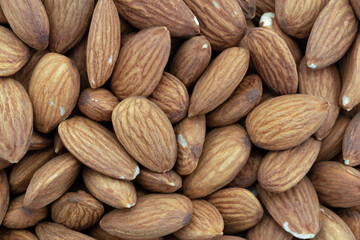 Close overhead view of a group of almond nuts.