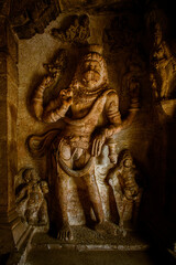Fototapeta na wymiar Sculpture of Lord Vishnu as Narasimha avatar at Badami cave temple,karnataka,India