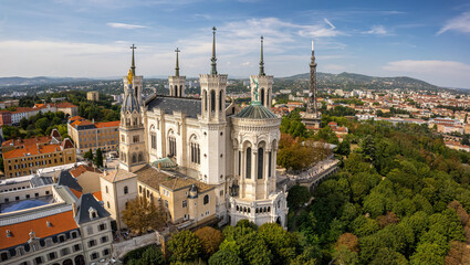 Aerial view of The Basilica of Notre-Dame de Fourvière and Lyon city.The Basilica of Notre-Dame de Fourvière is a minor basilica in Lyon. - obrazy, fototapety, plakaty
