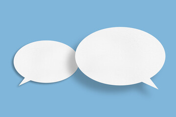 white paper with speech bubbles isolated on blue background communication bubbles