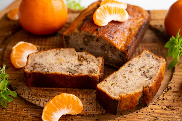 Fototapeta na wymiar Vegan cake with tangerine and fresh fruit.