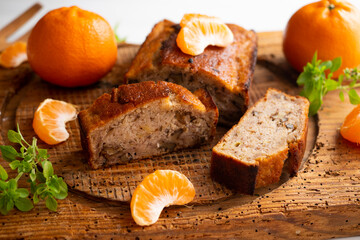 Vegan cake with tangerine and fresh fruit.