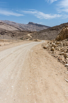Unpaved road in rocky and wild mountains in the Middle East, Arabian Peninsula 