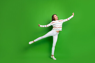Full length photo of funny dreamy girl dressed striped pullover dancing looking empty space...