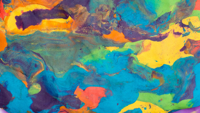 Background texture from multi-colored children's plasticine. Top view flat lay. Empty space.