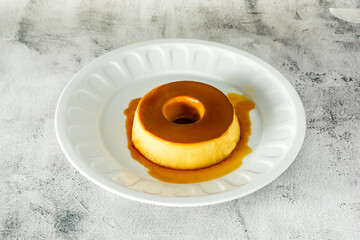 brazilian pudding or flan on white dish