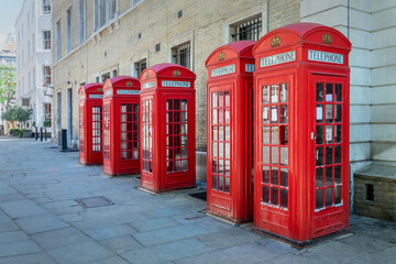 Five red phone booths in a row in Covent garden, London, UK