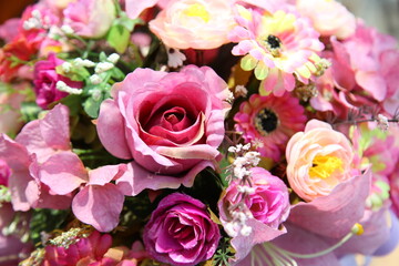 Fototapeta na wymiar Close up of artificial flower bouquet.