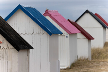 Beach cabins in Gouville sur Mer, Manche, Normandy, France in various lights - obrazy, fototapety, plakaty