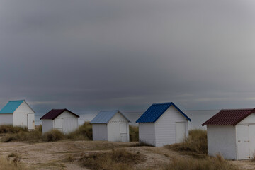 Beach cabins in Gouville sur Mer, Manche, Normandy, France in various lights