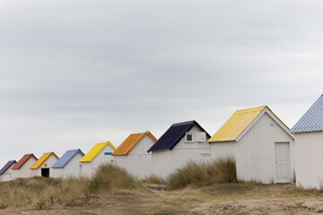 Beach cabins in Gouville sur Mer, Manche, Normandy, France in various lights