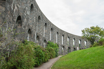 Lancet arches of McCaig's Tower aka McCaig's Folly prominent tower built of Bonawe granite on Battery Hill overlooking the town of Oban in Argyll, Scotland, UK