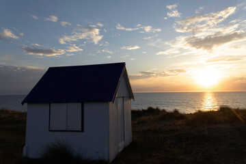 Beach cabins in Gouville sur Mer, Manche, Normandy, France in various lights