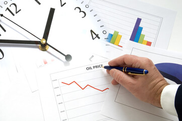 Concept Image Representing Time and Oil Investments with Graphs and Clock