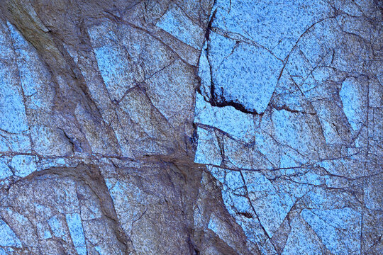 Cracked granite surface in nature