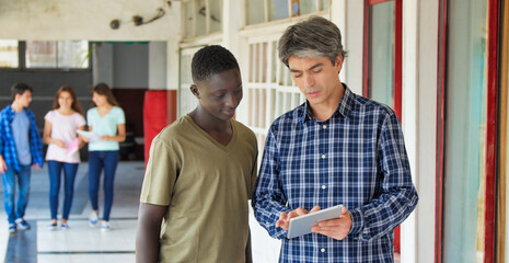 Teacher talking to the students at school