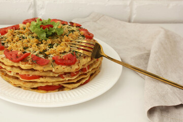 layered vegetable cake made from zucchini, lentils and tomatoes close up