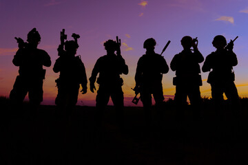A group of soldiers at sunset