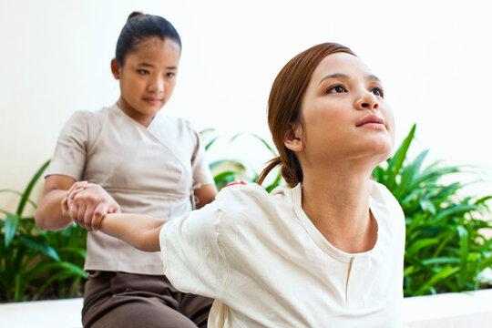 Woman receiving a Thai massage outdoors at a hotel Spa.  Siem Reap, Cambodia. 