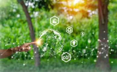 Hand holding with environment Icons over the Network connection on green background,environment...