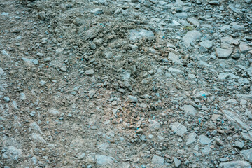 Old stone road texture on the mountain hill. Rocky. Tile. Drought. Toughness. Pieces. Monotone. Transportation. Hill. Roadway. Vintage. Cobble. Cobblestone. Weathered. Pavement. Small. Brick. Dry