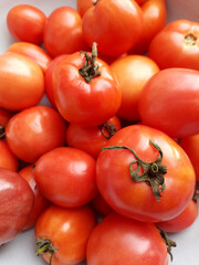 Home grown ripe tomatoes, organic healthy food from the garden, sustainable farming, natural texture, background.