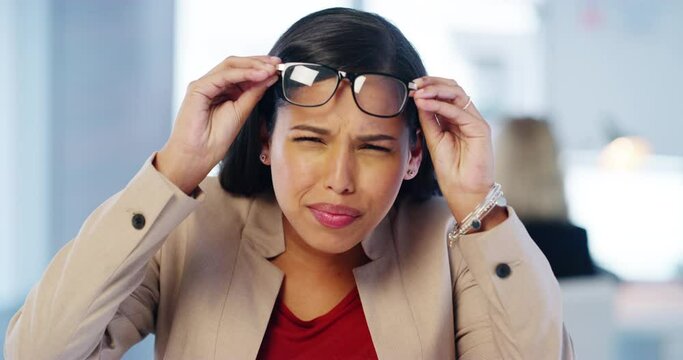 Business woman with poor eyes or vision with glasses in a company office. Portrait of a confused corporate worker suffering with bad eyesight and fatigue with transparent spectacles or eyewear