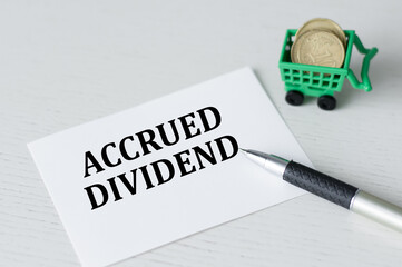 On the business card is the text accrued DIVIDEND