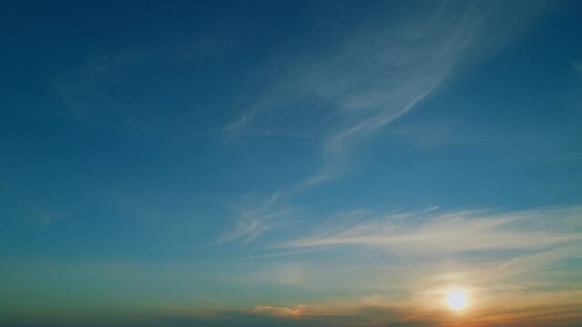 Rainbow sky clouds sunset with jet streams contrails. Burning sky and shining, romantic colorful sunset. Time lapse.