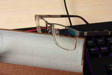 Office Employee Glasses. Glasses on the keyboard