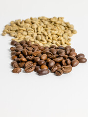 roasted and unroasted coffee beans on white background