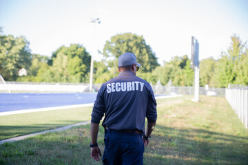 Security guard patrolling soccer stadium