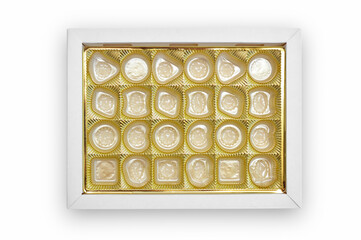 Empty candy box on white background. Gold color tray for candy and confectionery products.