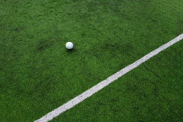 Soccer ball and a line of a football field
