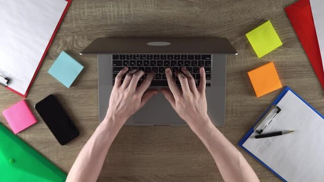 Guy is earn money developing the websites using laptop.