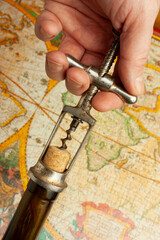 bottle of wine and old corkscrew