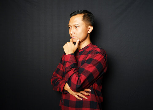 Businessman is thinking about the future isolated on black background.