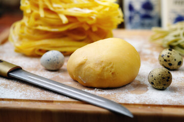 Dough for Italian pasta with quail eggs. Homemade food.Rustic.