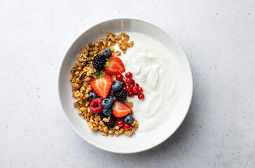Muesli or crunch with yogurt and fresh berries - obrazy, fototapety, plakaty