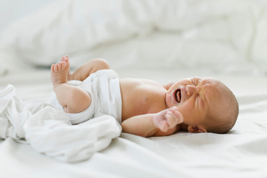 Newborn boy (0-1 months) crying