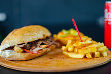 Meat doner kebab in sandwich bread. Traditional Turkish cuisine delicacies. Selective focus.
