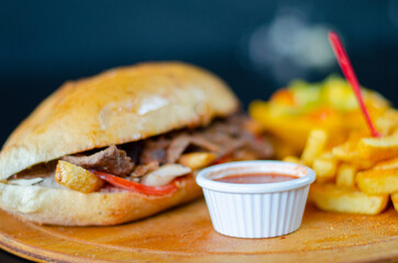Meat doner kebab in sandwich bread. Traditional Turkish cuisine delicacies. Selective focus.
