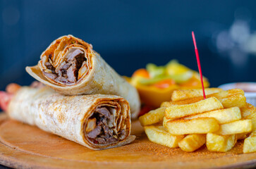 Doner kebab wrap in lavash bread. Traditional Turkish cuisine doner kebab. kebab in lavash bread....