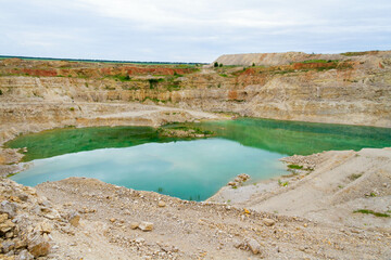 Lake formation in an old abandoned quarry. Quarry lake.