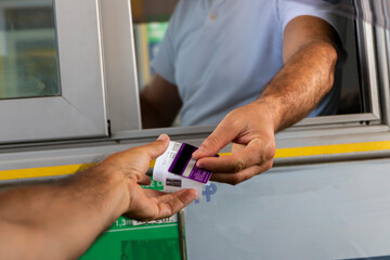 Payment of the fare on the way. Concept of new technologies in road transport and toll roads.
