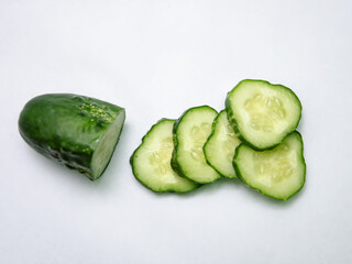 sliced ​​cucumber, cucumber cut into rings on a light background