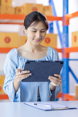 Obraz premium Young Asian woman entrepreneur SME Startup small Business owner working at home for online shopping and preparing package product deliver to customers, Asian Online SME business entrepreneurs ideas,
