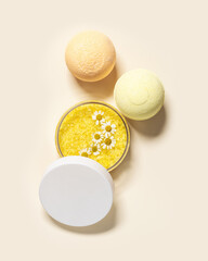 Bath bomb, bath salt sea with herbal extract of chamomile, sea salt crystals in jar, natural chamomile flowers. Home care concept, relax and rest, bath procedure, body care cosmetic