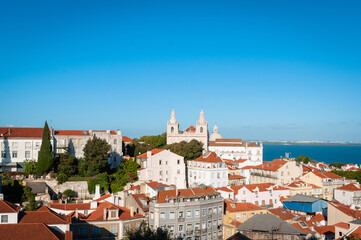Fototapeta premium Tourist view of Churches, Rooftops and cityscape of Lisboa, Portugal