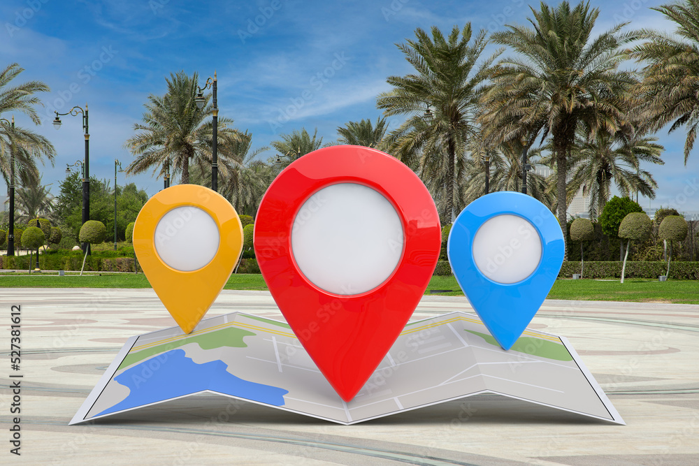 Poster folded abstract navigation map with three target map pointer pins on an empty city street with palm 